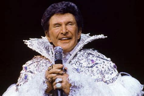 how old was liberace when he died.